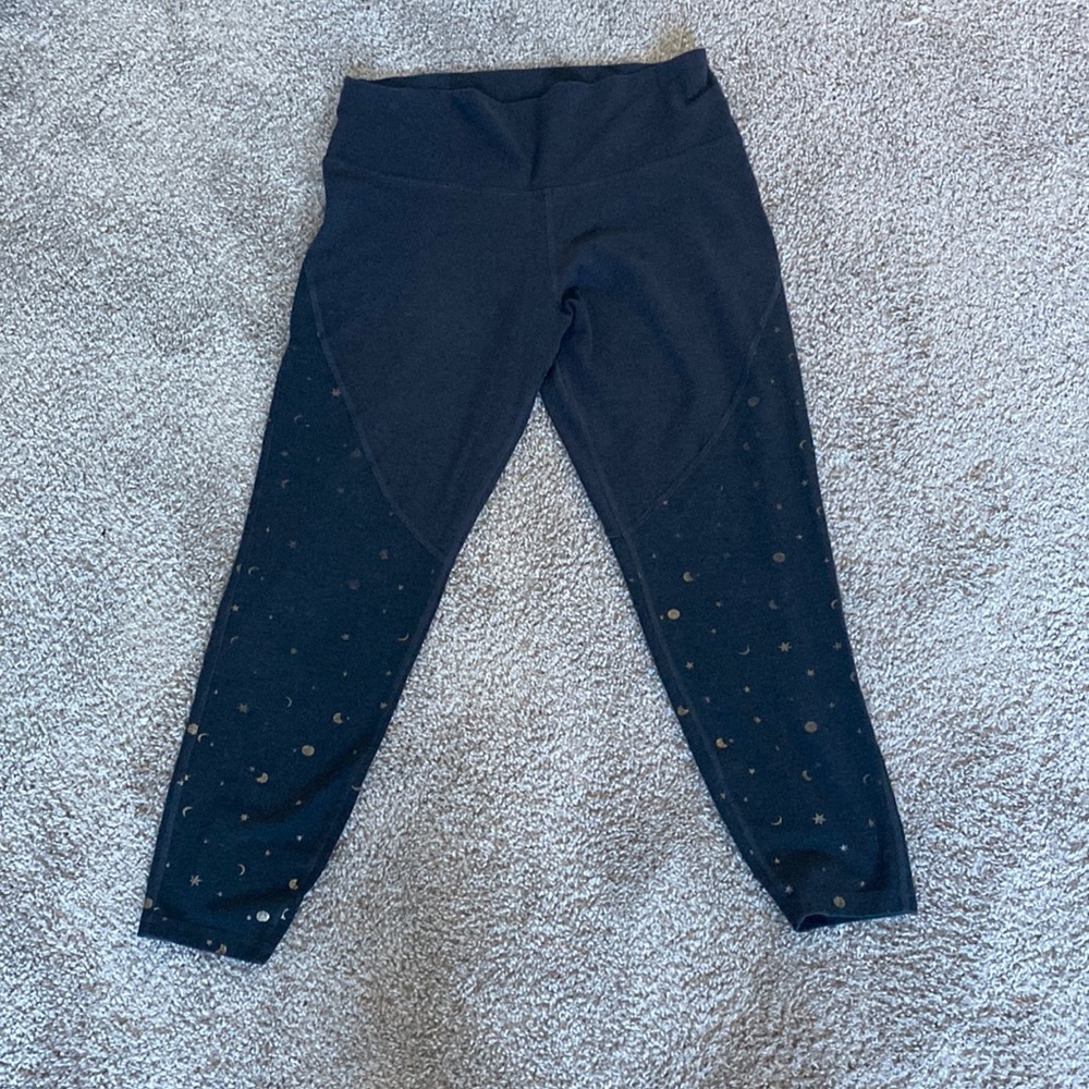 Old navy yoga pants with holographic sun, moon, and stars. Size large